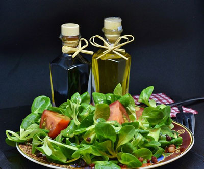 oil and vinegar cruets and salad